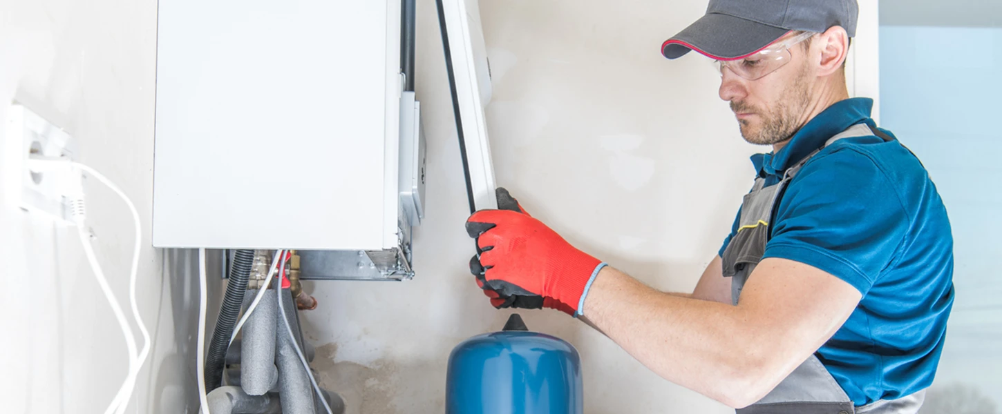 a man working on a heater