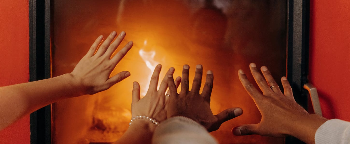 People enjoying a warm gas fire place